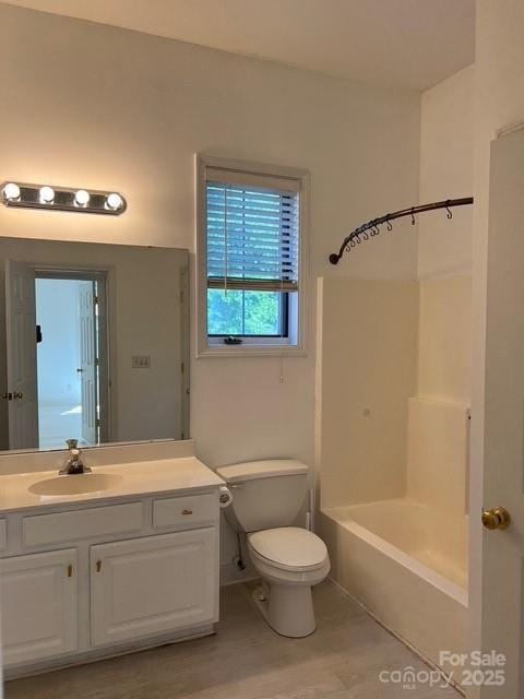 full bathroom featuring vanity, toilet, shower / bath combination, and hardwood / wood-style floors