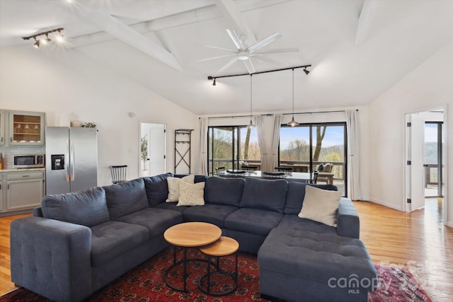 423 Grouse Thicket Rd Unit 238, Mars Hill, NC 28754 - living area featuring rail lighting, light wood finished floors, a ceiling fan, beam ceiling, and high vaulted ceiling