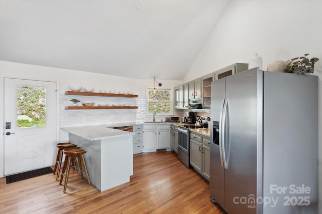 423 Grouse Thicket Rd Unit 238, Mars Hill, NC 28754 - kitchen with stainless steel appliances, a peninsula, a sink, open shelves, and light wood-type flooring