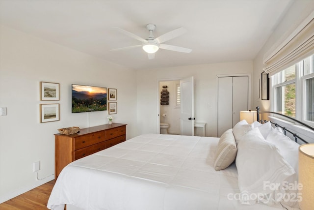 423 Grouse Thicket Rd Unit 238, Mars Hill, NC 28754 - bedroom featuring wood finished floors, connected bathroom, ceiling fan, baseboards, and a closet