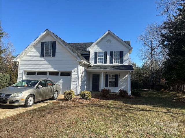 view of front property with a garage, a front yard, and covered porch