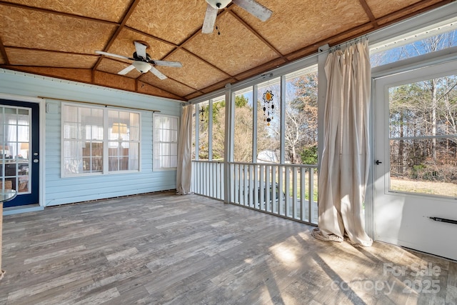 unfurnished sunroom with lofted ceiling and ceiling fan