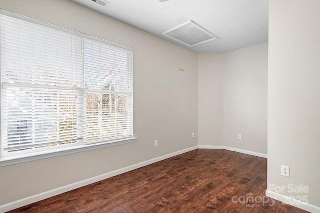 unfurnished room featuring dark hardwood / wood-style flooring