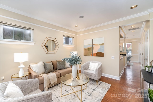 living room with hardwood / wood-style flooring and ornamental molding