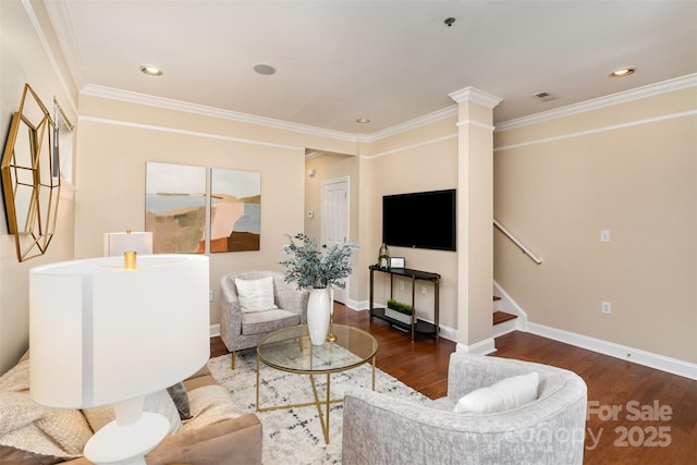 living room with ornamental molding, dark hardwood / wood-style floors, and decorative columns