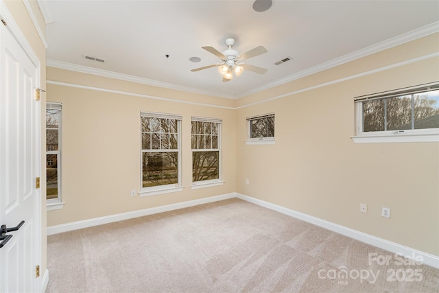 empty room with light carpet, ornamental molding, and ceiling fan