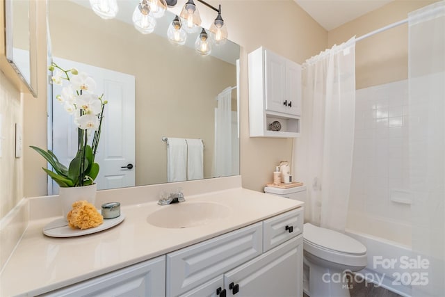 full bathroom with vanity, toilet, and shower / bath combo with shower curtain