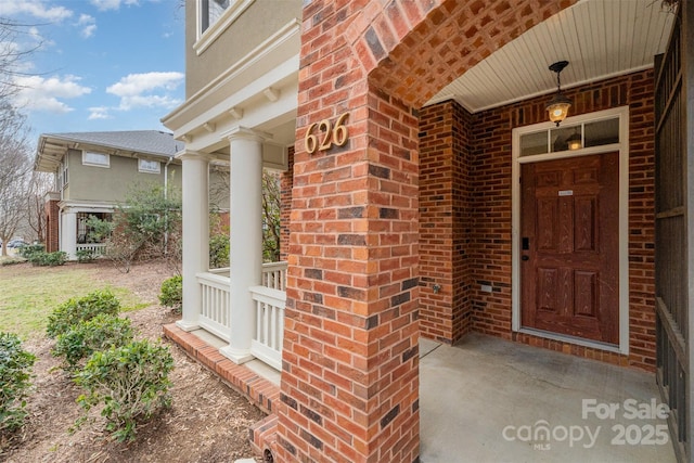 doorway to property with covered porch