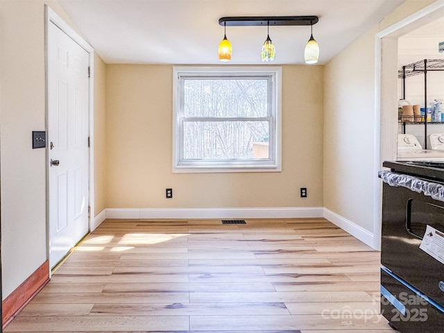 dining area with light hardwood / wood-style floors