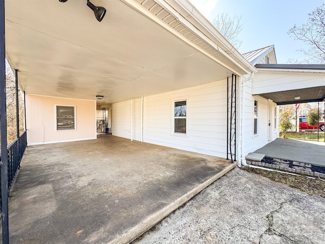 view of side of property with a carport