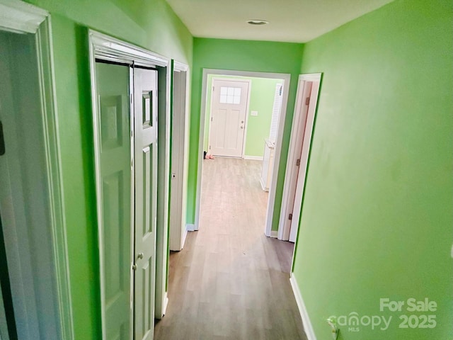 hallway featuring light hardwood / wood-style flooring