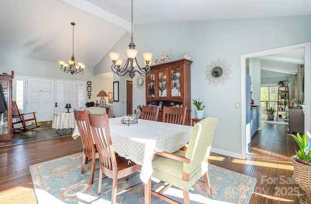 dining room featuring an inviting chandelier, baseboards, dark wood-style floors, and beamed ceiling