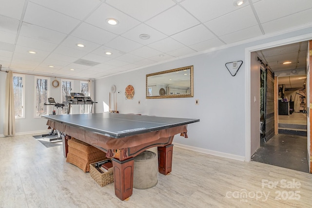 game room with light wood-type flooring, a drop ceiling, baseboards, and recessed lighting