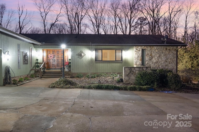 view of front of home featuring stone siding