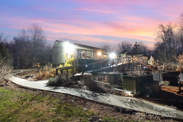 view of back of house at dusk