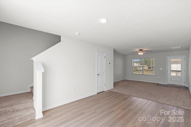 unfurnished living room with light hardwood / wood-style floors and ceiling fan