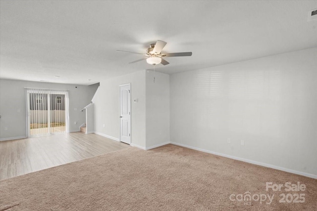 carpeted empty room with ceiling fan