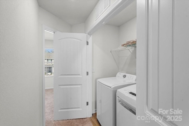 washroom with separate washer and dryer