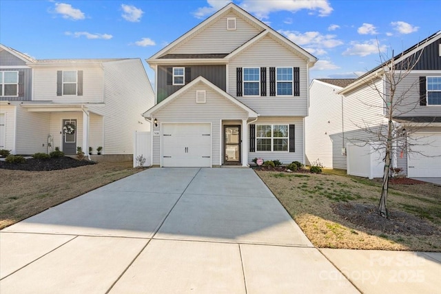 view of front property with a garage and a front yard