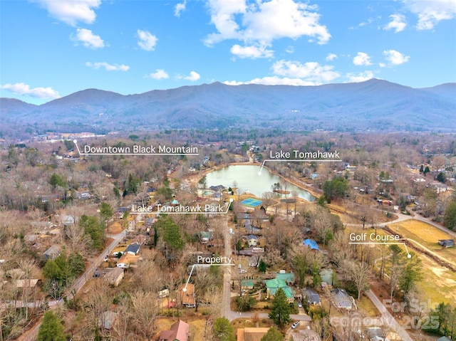 aerial view featuring a water and mountain view