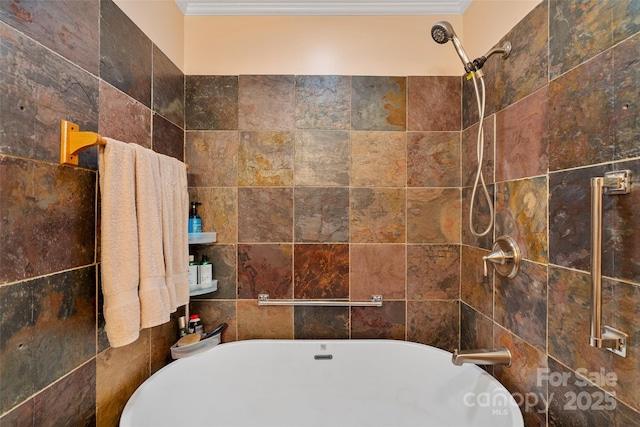 bathroom featuring tiled shower and ornamental molding