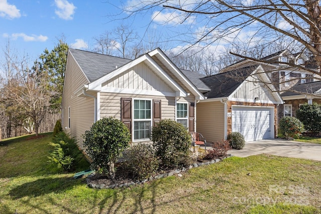 view of front of property featuring a garage and a front lawn