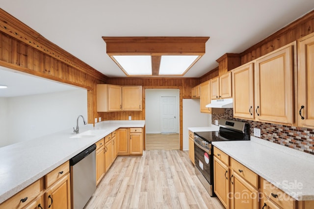 kitchen featuring sink, light hardwood / wood-style flooring, light brown cabinets, stainless steel appliances, and backsplash