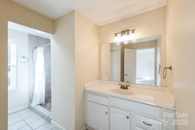 bathroom with vanity, curtained shower, and tile patterned floors