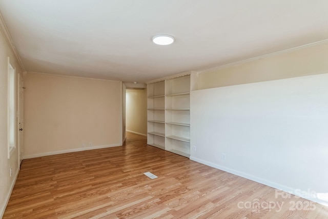 spare room with light wood-type flooring