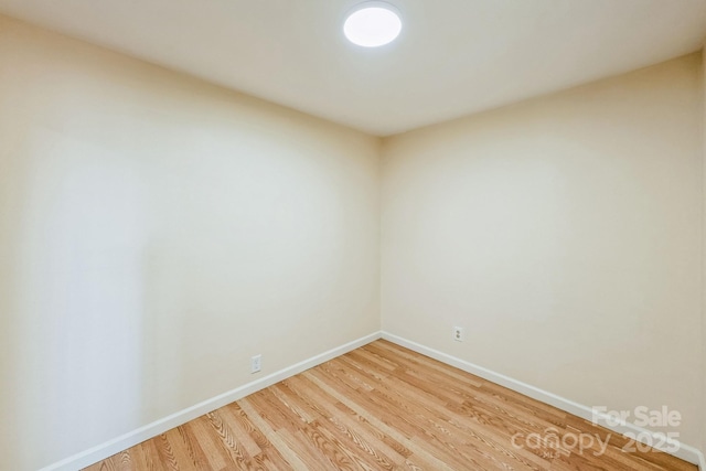 unfurnished room with hardwood / wood-style floors