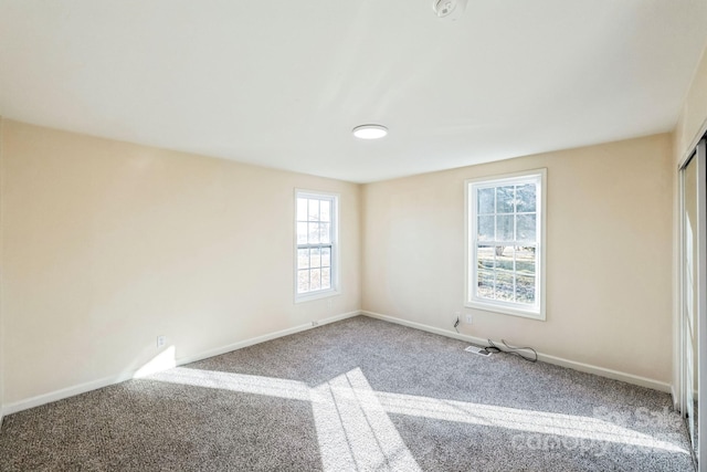 unfurnished room featuring carpet floors