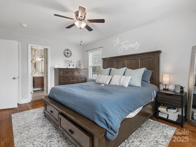 bedroom featuring dark wood-style floors, connected bathroom, and a ceiling fan