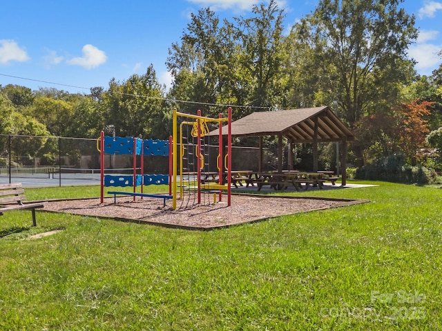 community playground with a tennis court, a gazebo, and a yard