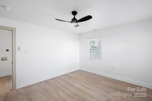 unfurnished room featuring ceiling fan and light wood-type flooring