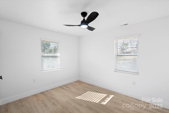 spare room with ceiling fan and light hardwood / wood-style floors