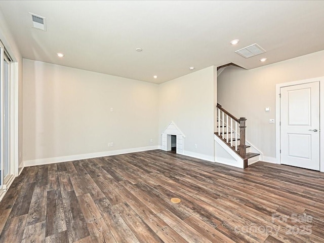 unfurnished living room with dark hardwood / wood-style floors