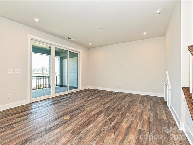 unfurnished living room featuring dark wood-type flooring