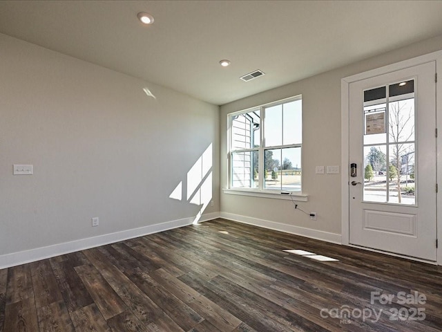 unfurnished room featuring dark hardwood / wood-style floors