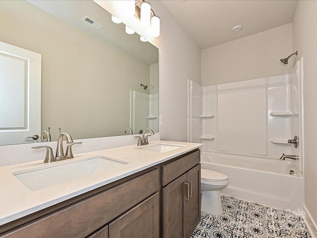 full bathroom featuring bathtub / shower combination, tile patterned floors, toilet, and vanity