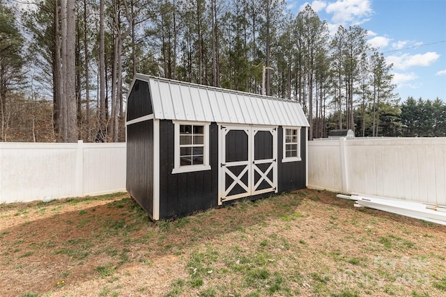 view of shed featuring a fenced backyard