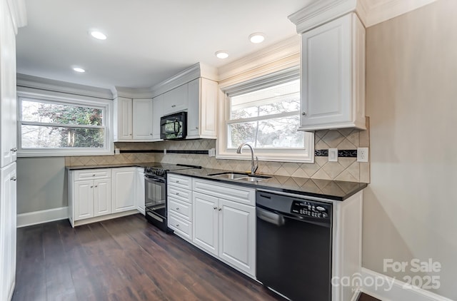 kitchen with white cabinetry, sink, dark hardwood / wood-style flooring, decorative backsplash, and black appliances