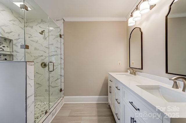 bathroom featuring ornamental molding, an enclosed shower, and vanity