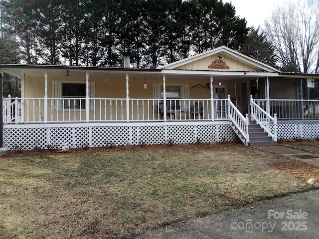 view of front of home with a porch and a front lawn