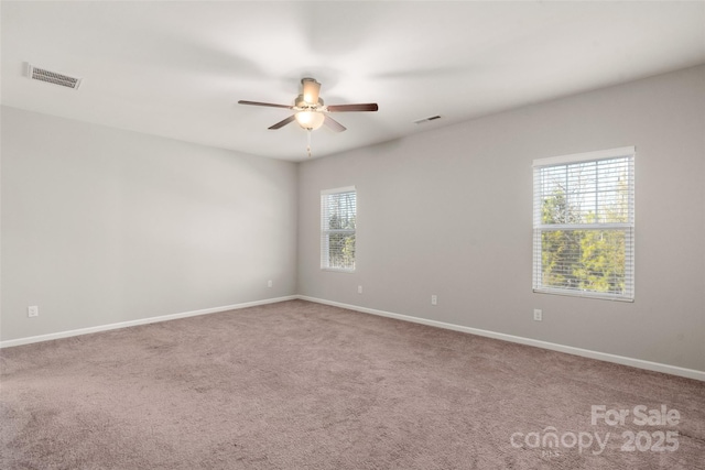 empty room with carpet flooring and ceiling fan