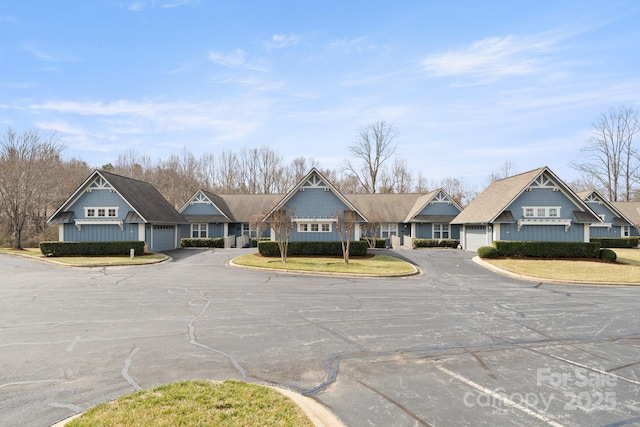 view of road with a residential view and curbs