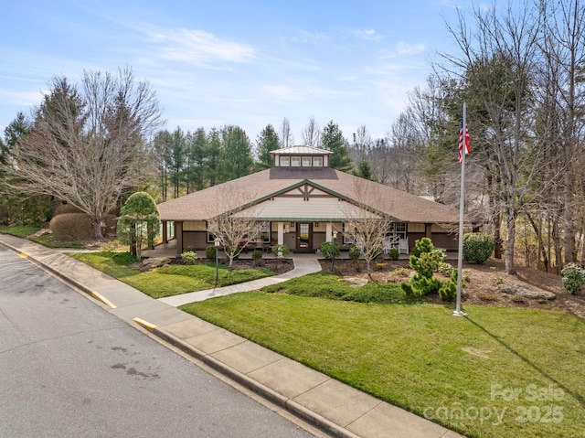 exterior space with driveway and a yard