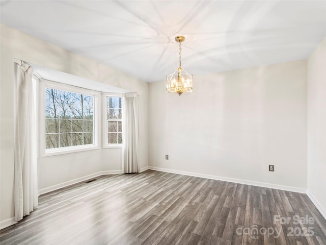 416 Hunters Glen Ln, Hendersonville, NC 28739 - empty room featuring baseboards, an inviting chandelier, wood finished floors, and visible vents