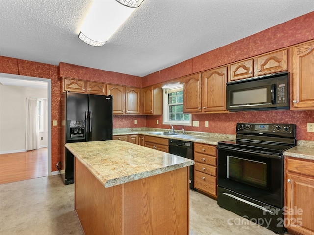416 Hunters Glen Ln, Hendersonville, NC 28739 - kitchen featuring brown cabinets, light countertops, a textured ceiling, a center island, and black appliances