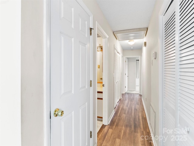416 Hunters Glen Ln, Hendersonville, NC 28739 - corridor with baseboards, visible vents, and wood finished floors