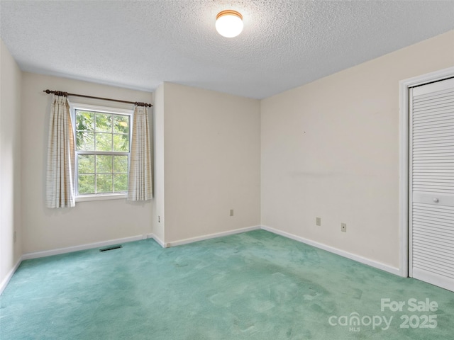416 Hunters Glen Ln, Hendersonville, NC 28739 - carpeted empty room with a textured ceiling, visible vents, and baseboards